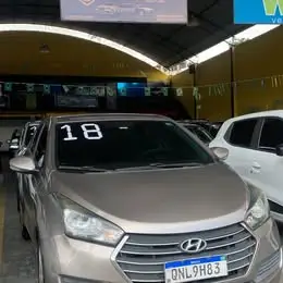 🔥 HB20S COMFORT PLUS 1.0 | 2018 – O SEDÃ QUE O BRASILEIRO CONFIA! 🔥 🚨 CHEGOU A SUA CHANCE DE SAIR DE CARRO NOVO! 🚨 Se você procura um sedã econômico, confortável, moderno e com excelente valor de revenda, esse Hyundai HB20S 1.0 2018 é a escolha certa! ✅ Motor 1.0 Flex – Econômico e confiável. ✅ Câmbio Manual – Leve, preciso e de baixa manutenção. ✅ Ar-condicionado – Conforto em qualquer estação. ✅ Direção elétrica – Muito mais leve e prazer ao dirigir. ✅ Vidros, travas e retrovisores elétricos. ✅ Central multimídia (se equipada). ✅ Porta-malas amplo – Ideal para família, viagens e trabalho. ✅ Excelente consumo de combustível – Economia de verdade no dia a dia. ✅ Baixa manutenção e peças com ótimo custo-benefício. ✅ Design moderno que continua valorizado no mercado. 💥 POR QUE COMPRAR NA TRIAUTO MOTORS? ✔️ Veículos com procedência e qualidade garantidas. ✔️ Transparência total na negociação. ✔️ Documentação revisada e pronta para transferência. ✔️ Financiamento facilitado com as melhores taxas. ✔️ Aceitamos seu usado na troca com excelente avaliação. ✔️ Atendimento personalizado do início ao fim, sem enrolação. 🚗 NÃO DEIXE ESSA OPORTUNIDADE ESCAPAR! Carros como esse vendem rápido! Quem chega primeiro faz o melhor negócio. 📲 Fale agora com a Triauto Motors: WhatsApp (21) 99933-4277 TRIAUTO MOTORS Confiança que move seus sonhos. 📍 Seu próximo carro está aqui. Venha fazer um test drive e descubra por que cada vez mais clientes escolhem a Triauto Motors!